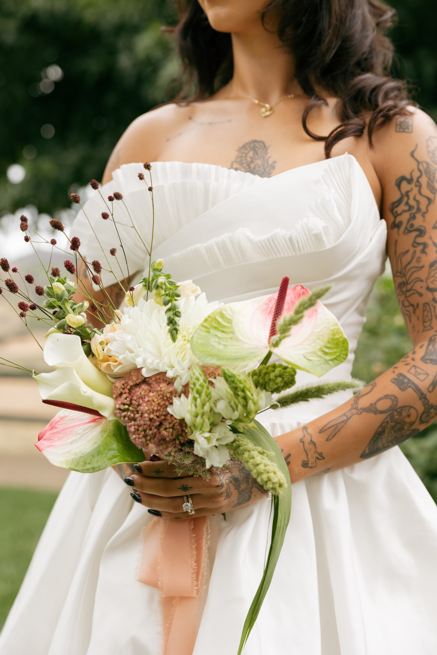 Calla lily, anthurium, and scabiosa bouquet, an example of seasonal wedding flowers October